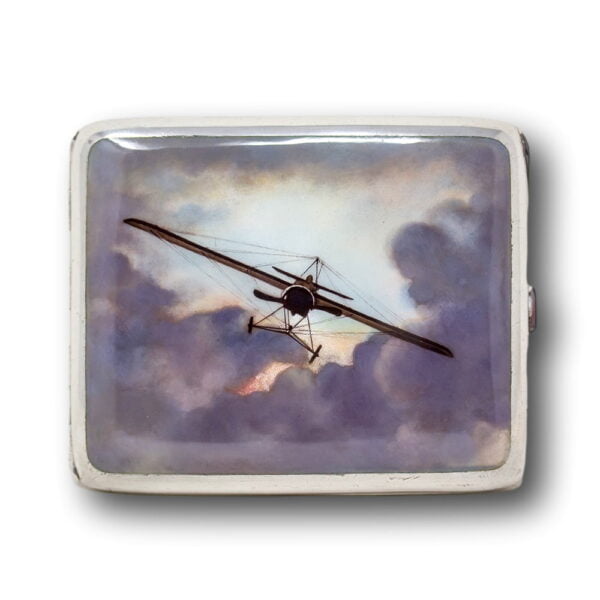 The front profile of a German silver and enamel cigarette case featuring a plane.