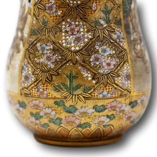 lower third of the vase with gilt decoration and blossoming flowers