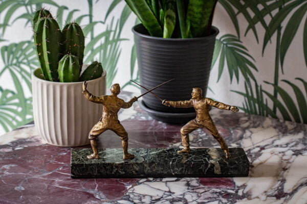 French fencing bronze figure in a decorative setting