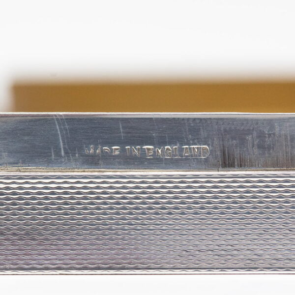 Close up of the Made in England mark on the Asprey Horse Silver Cigarette Case