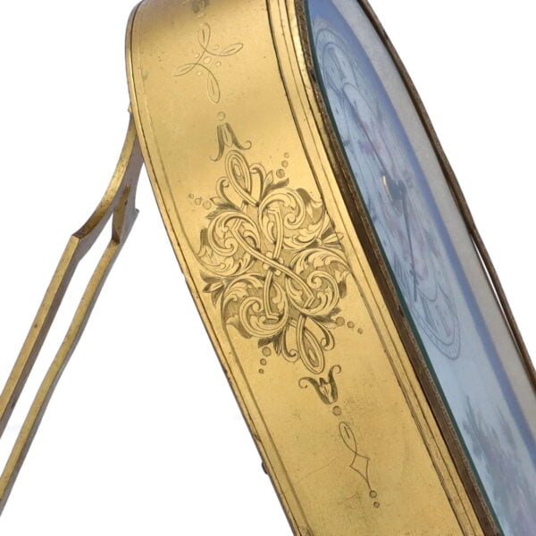 Close up of the engraving to the gilt brass body of the English Porcelain Dial Dome Top Strut Clock