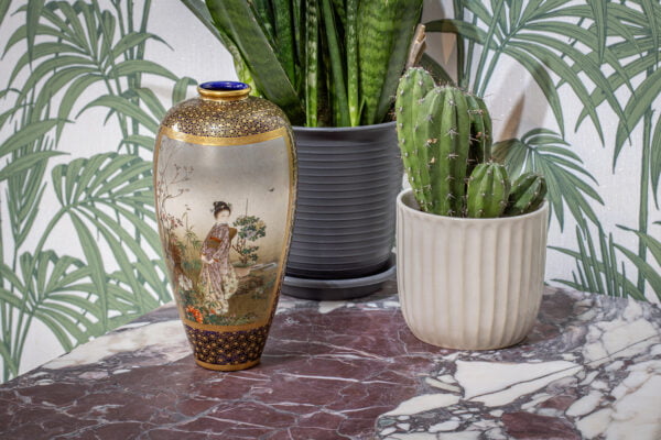 The Kinkozan satsuma vase in a decorative collectors setting to see the scale.