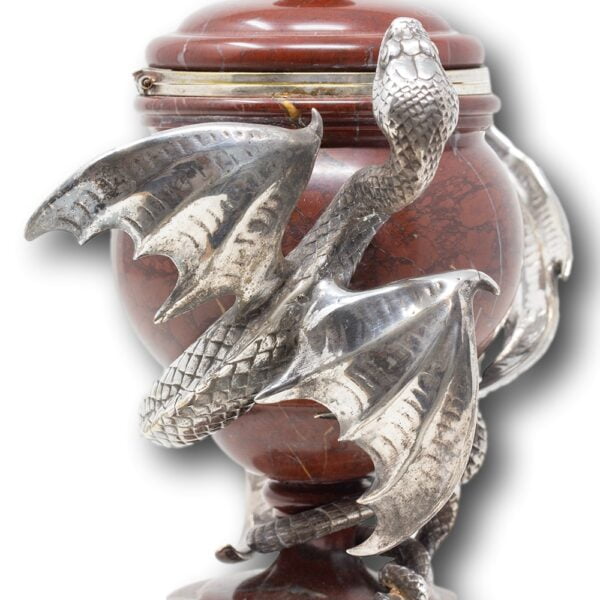 Close up of the silver plated winged serpent