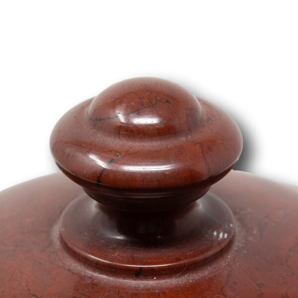 Close up of the rouge marble finial
