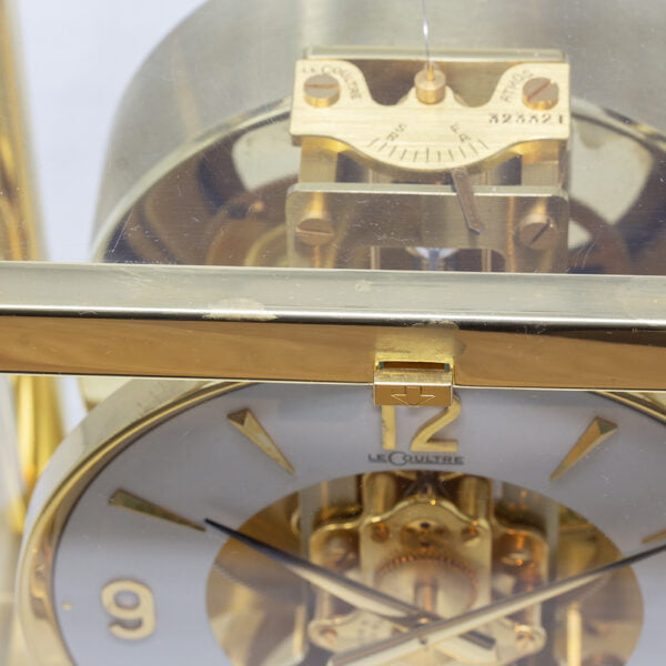 Close up of the mid century modern Jaeger-LeCoultre Atmos Clock circa 1970 top with scratches and lacquer peel