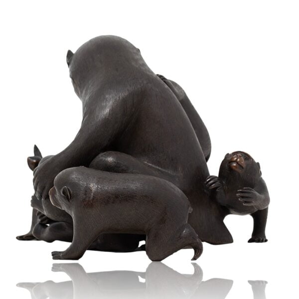 Side overview of the Japanese Bronze monkey group okimono