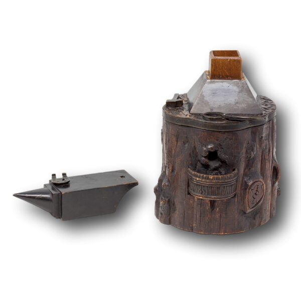 Black Forest tobacco jar smokers compendium with the anvil lifted off to access the hidden compartment vesta case