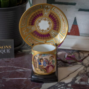 Vienna porcelain cup and saucer in a decorative setting